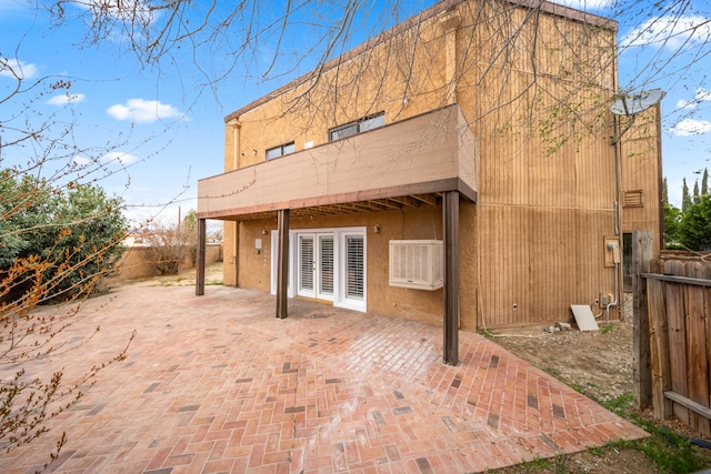 back of house with a patio area, stucco siding, and fence