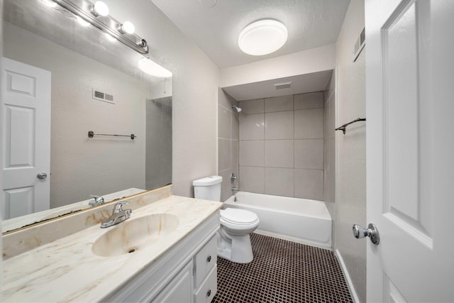 bathroom featuring vanity, visible vents, shower / bath combination, tile patterned floors, and toilet