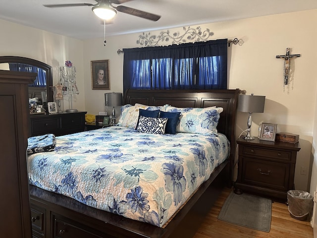 bedroom featuring wood-type flooring and ceiling fan