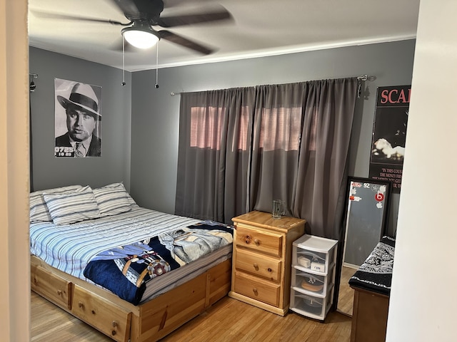 bedroom featuring ceiling fan and wood-type flooring