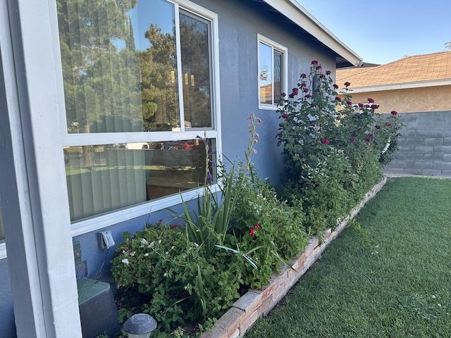 view of home's exterior with a lawn