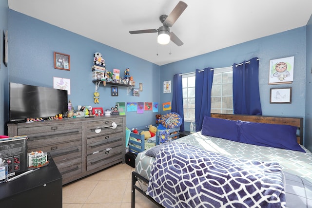 bedroom with ceiling fan and light tile patterned floors