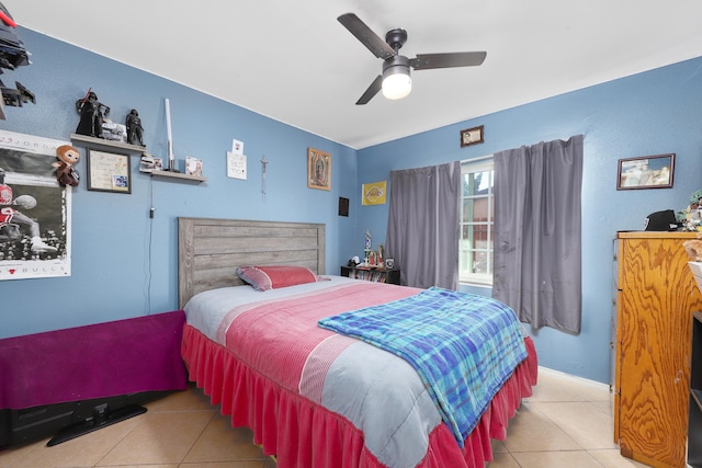 bedroom featuring light tile patterned floors and ceiling fan