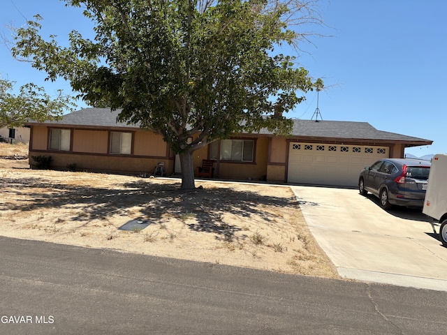 17306 Lakespring Ave, Palmdale, CA 93591 - view of front of house with an attached garage, driveway, and a shingled roof
