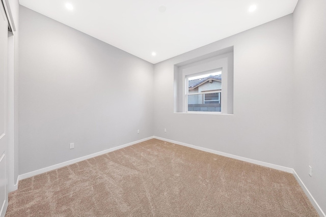 unfurnished room featuring carpet flooring