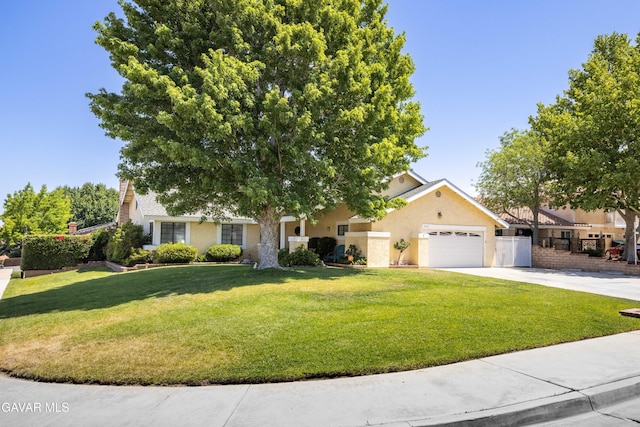 2747 Wilson Ct, Lancaster, CA 93536 - obstructed view of property with concrete driveway, a garage, stucco siding, and a front lawn