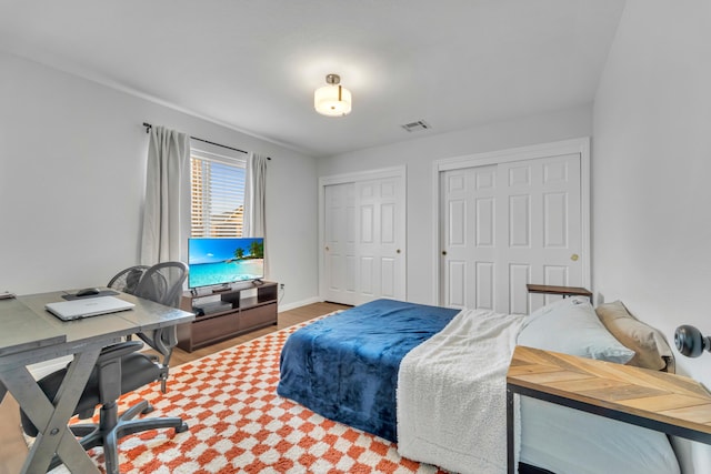 bedroom with visible vents and baseboards