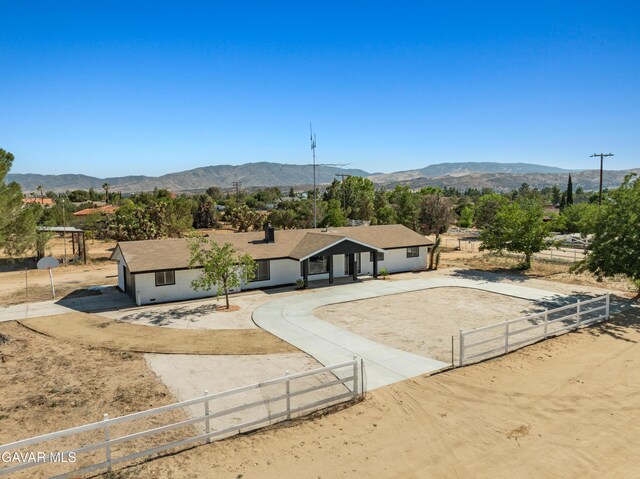 2350 W W Ave N Unit 12, Palmdale, CA 93551 - ranch-style home with a fenced front yard, a mountain view, and stucco siding
