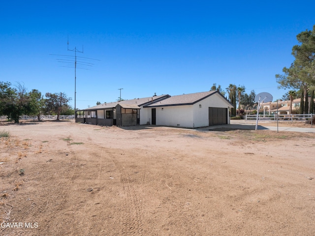 2350 W W Ave N Unit 12, Palmdale, CA 93551 - view of front of property featuring driveway and a garage
