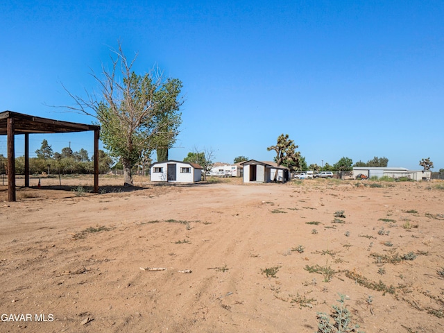 2350 W W Ave N Unit 12, Palmdale, CA 93551 - view of yard featuring a storage shed