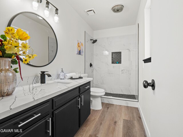 2350 W W Ave N Unit 12, Palmdale, CA 93551 - bathroom featuring vanity, wood finished floors, and a marble finish shower