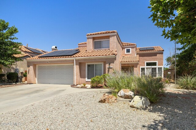 38030 Lido Dr, Palmdale, CA 93552 - mediterranean / spanish home featuring solar panels, stucco siding, and concrete driveway