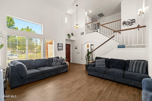 38030 Lido Dr, Palmdale, CA 93552 - living room featuring wood finished floors, stairs, and a towering ceiling