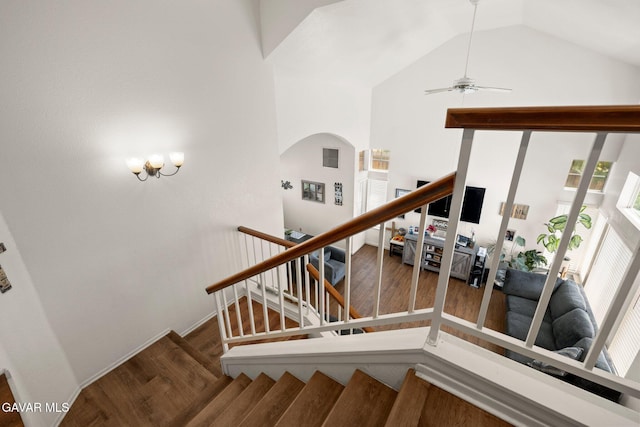 38030 Lido Dr, Palmdale, CA 93552 - stairs with wood finished floors, arched walkways, vaulted ceiling, and ceiling fan