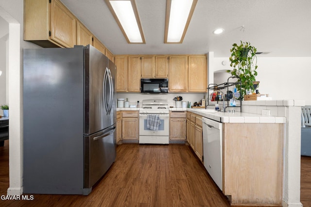 38030 Lido Dr, Palmdale, CA 93552 - kitchen with white appliances, a peninsula, dark wood-style flooring, tile countertops, and recessed lighting