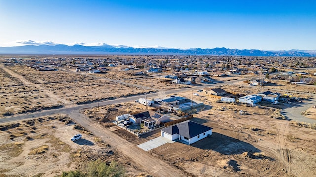 bird's eye view featuring a mountain view and a desert view