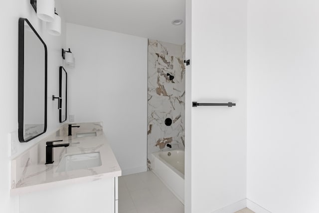 full bathroom with a sink, baseboards, shower / washtub combination, and double vanity