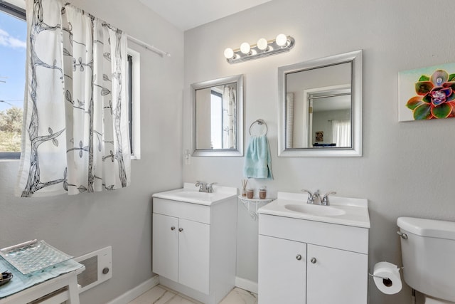 23761 El Rancho Dr, Tehachapi, CA 93561 - full bathroom featuring two vanities and toilet