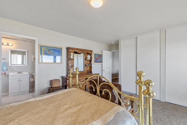 23761 El Rancho Dr, Tehachapi, CA 93561 - bedroom with ensuite bathroom, multiple closets, a sink, and carpet floors
