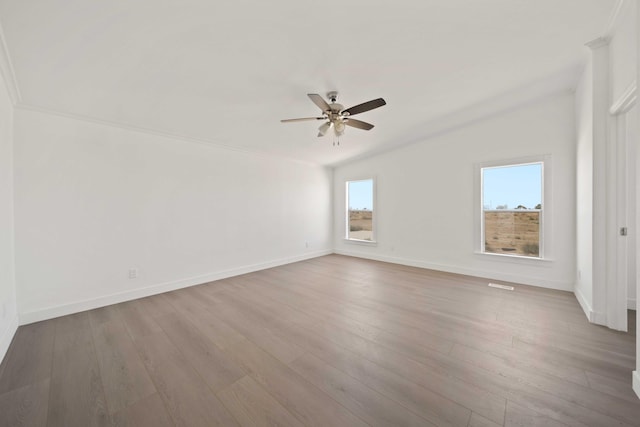 empty room with ceiling fan and light wood-type flooring