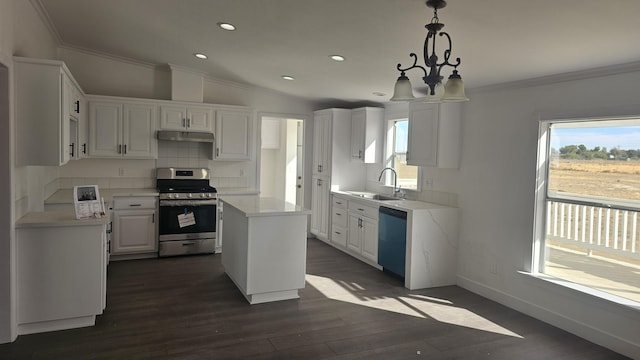 kitchen featuring dishwashing machine, pendant lighting, stainless steel range oven, a center island, and white cabinetry