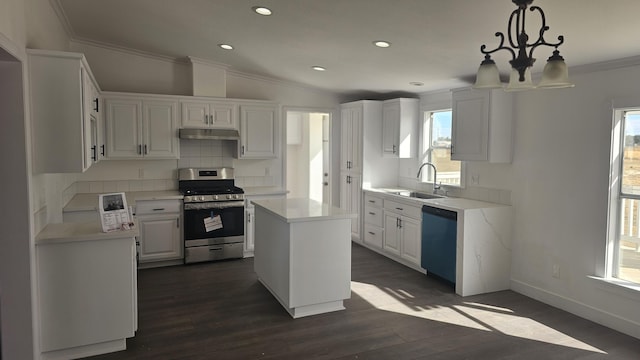 kitchen with pendant lighting, white cabinets, sink, a kitchen island, and stainless steel range oven