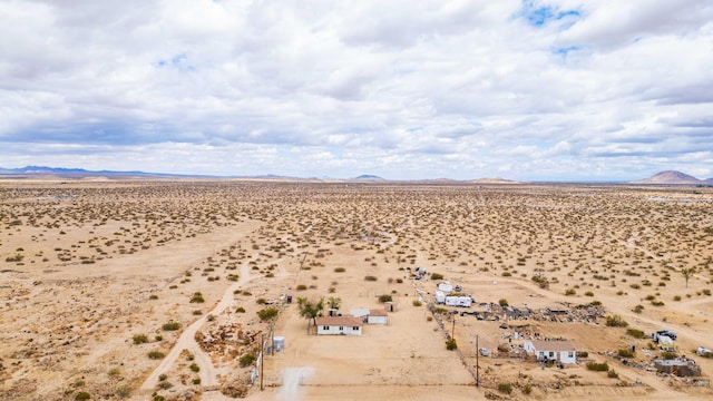 bird's eye view featuring a rural view, a mountain view, and a desert view