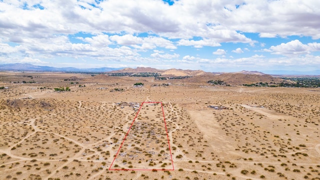 mountain view with a rural view and view of desert