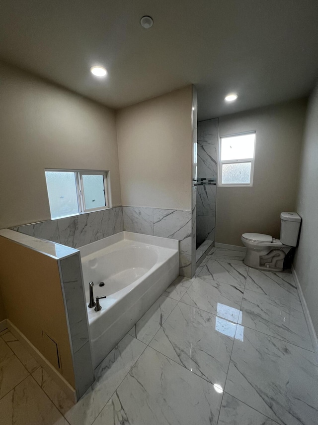 bathroom with plus walk in shower and toilet