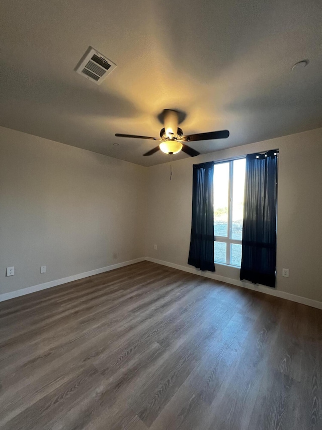 40004 171th Street E, St, Lake Los Angeles, CA 93591 - spare room with dark wood-style floors and a ceiling fan