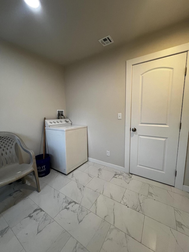 clothes washing area featuring washer / clothes dryer