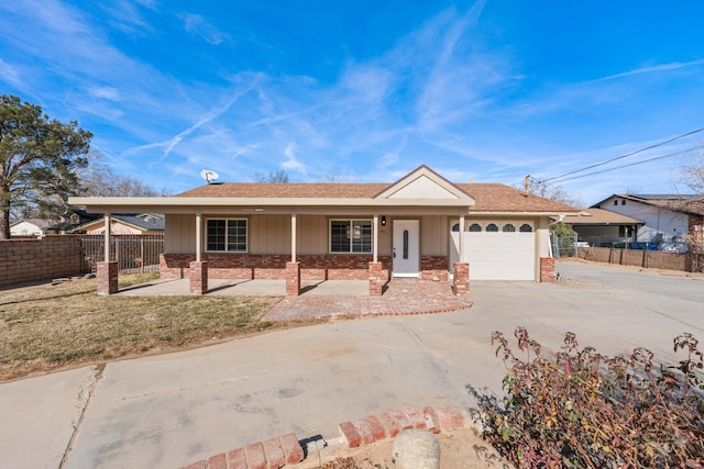 ranch-style house with a garage and a porch