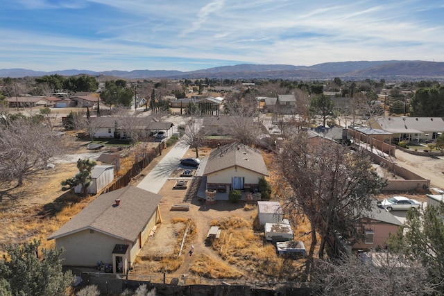 birds eye view of property featuring a mountain view