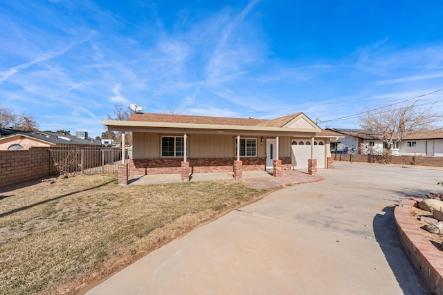 single story home featuring a garage and a front lawn