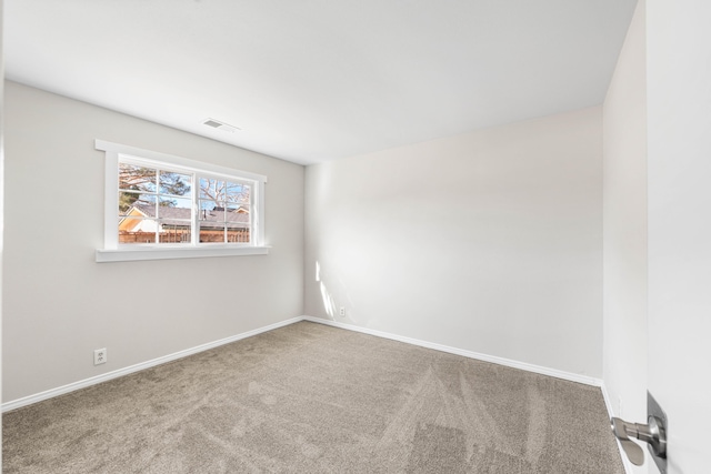 empty room featuring carpet floors