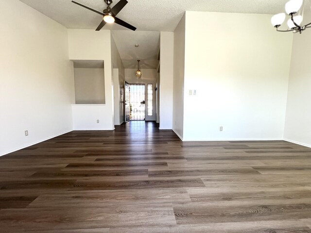 unfurnished living room with a textured ceiling, ceiling fan, light tile patterned floors, a fireplace, and lofted ceiling