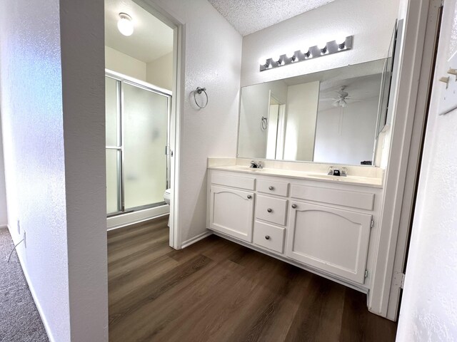 unfurnished room featuring light carpet, a textured ceiling, and ceiling fan