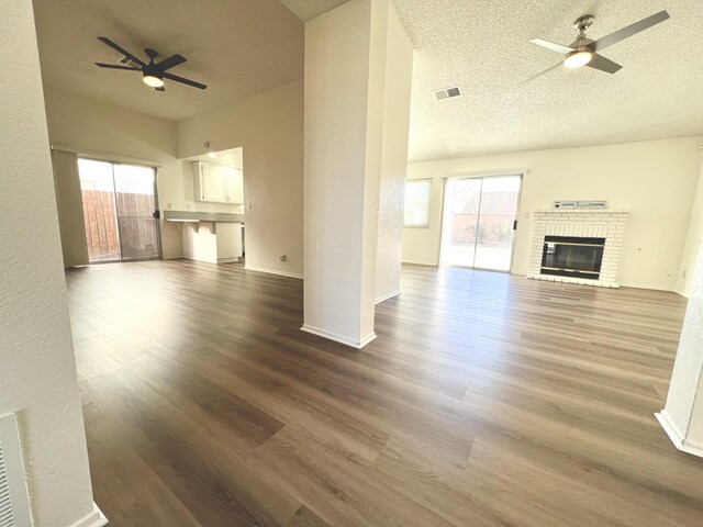 kitchen featuring kitchen peninsula, stainless steel appliances, sink, light tile patterned floors, and white cabinets