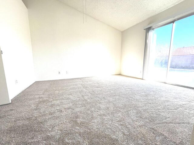 unfurnished living room with a textured ceiling, a notable chandelier, and light tile patterned flooring