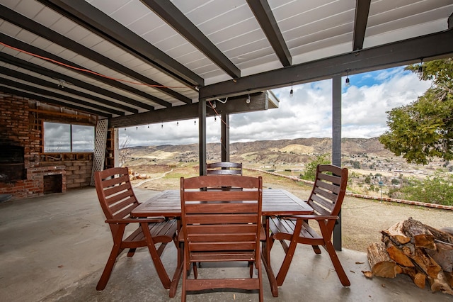 view of patio featuring outdoor dining space and a mountain view