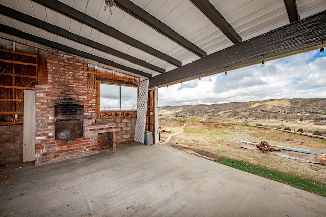 view of patio / terrace featuring a mountain view