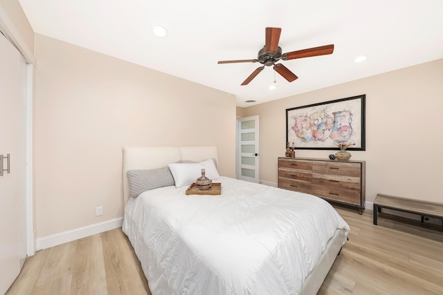 bedroom featuring recessed lighting, light wood-type flooring, baseboards, and a ceiling fan