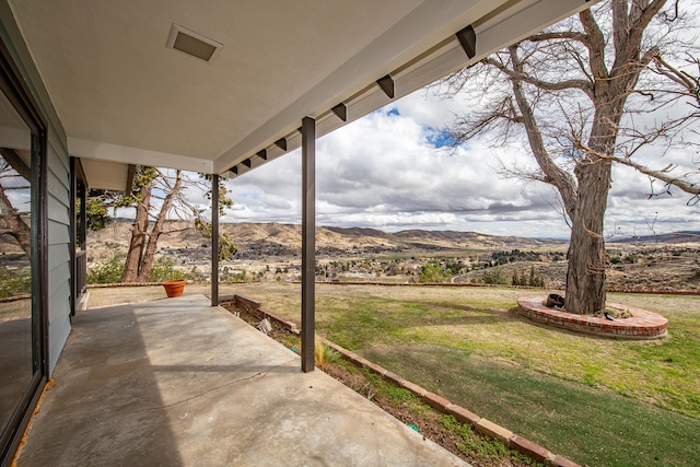 view of patio / terrace with a mountain view