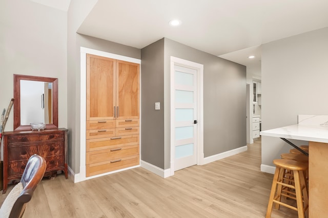 interior space with recessed lighting, baseboards, and light wood-style flooring