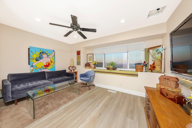 living room with visible vents, ceiling fan, baseboards, recessed lighting, and wood finished floors