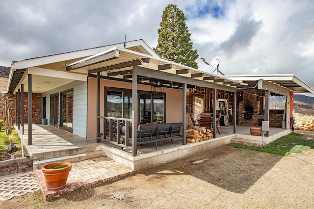 back of property with a patio area