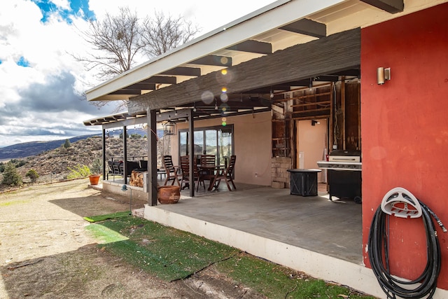 view of patio with a mountain view