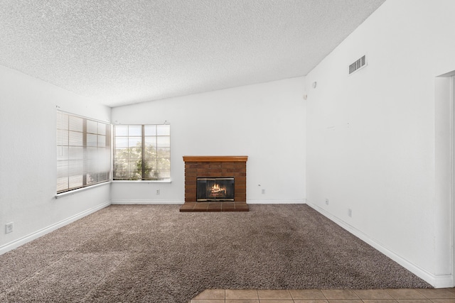 37756 E 45th St, Palmdale, CA 93552 - unfurnished living room featuring carpet, a textured ceiling, a brick fireplace, and baseboards