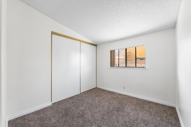 37756 E 45th St, Palmdale, CA 93552 - unfurnished bedroom with a textured ceiling, carpet floors, lofted ceiling, a closet, and baseboards
