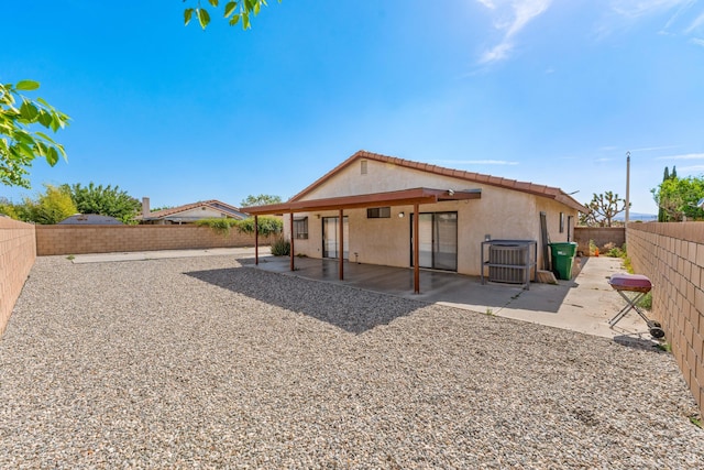 37756 E 45th St, Palmdale, CA 93552 - rear view of property with stucco siding, a tiled roof, a fenced backyard, and a patio